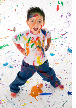 A boy covered in paint