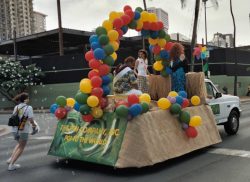 "Somewhere Over the Rainbow" meets "Tiny Bubbles" --- down Kalakaua Avenue in Waikiki Our Gay Pride Parade Float