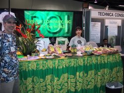 Rick Kelly and a glum looking Marjorie at the Natural Products Show in Anaheim, California. The table is laden with all sorts of poi goodies. We'd purchased green gels for the lights at one of the Hollywood lighting companies, so the Poi logo banner was really glowing. "Rockin' Rick" Kelly and Marjorie at The Poi Company Booth