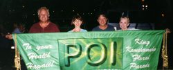 Marjorie and I walked the length of the Kamehameha Day Parade -- from Iolani Palace to Kapiolani Park -- with this banner, in front of The Poi Company floral float. Aimoku, Marjorie, Owen Ho, and Dorien With The Poi Banner