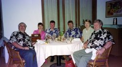 The PoiCo team celebrating the millennium at the Oahu Country Club -- From left to right: Craig Walsh, Marjorie Walsh, Kevin Howdle, Steve Patch, Cathy Bushby, John Bushby. Marjorie is holding a wooden box containing the ashes of Craig's father, John "Woody" Walsh, before they were interred at Punchbowl Memorial Cemetery.